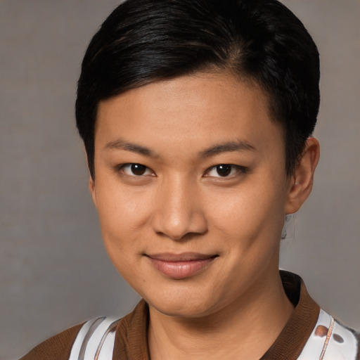 Joyful asian young-adult female with short  brown hair and brown eyes