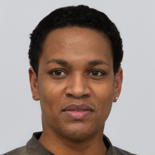 Joyful black young-adult female with short  black hair and brown eyes