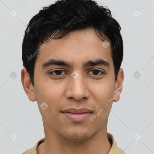 Joyful latino young-adult male with short  brown hair and brown eyes