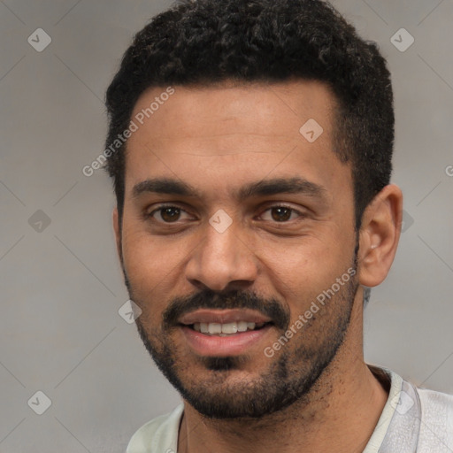 Joyful white young-adult male with short  black hair and brown eyes