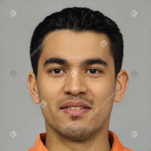 Joyful latino young-adult male with short  black hair and brown eyes