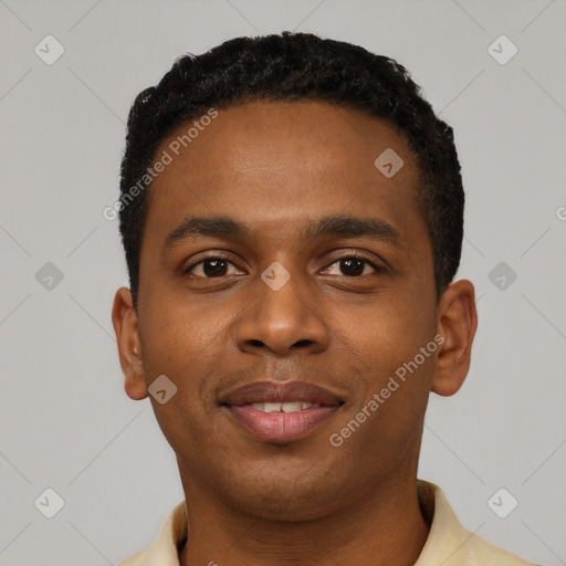 Joyful black young-adult male with short  black hair and brown eyes