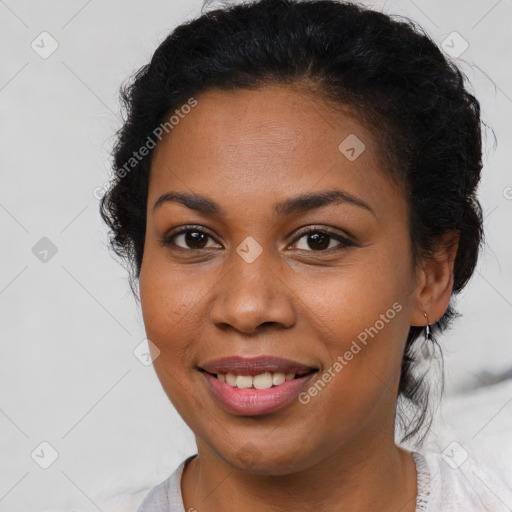 Joyful latino young-adult female with short  brown hair and brown eyes