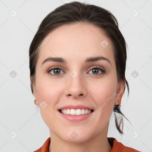 Joyful white young-adult female with medium  brown hair and grey eyes