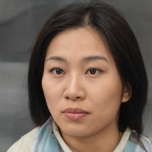 Neutral asian young-adult female with medium  brown hair and brown eyes