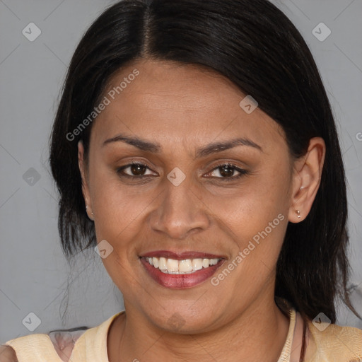 Joyful latino young-adult female with medium  brown hair and brown eyes