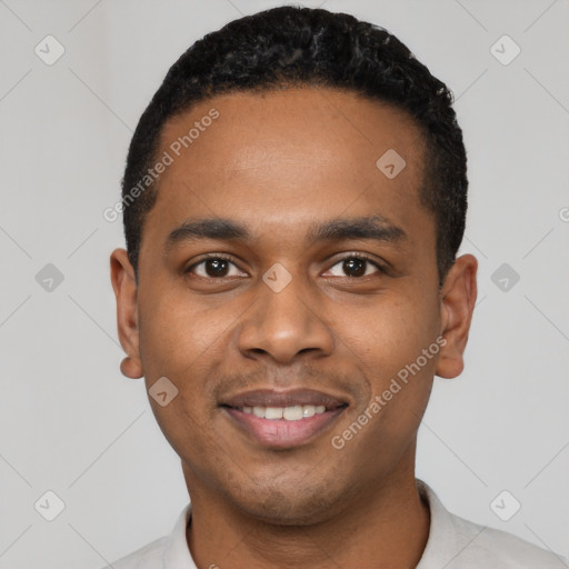 Joyful black young-adult male with short  black hair and brown eyes