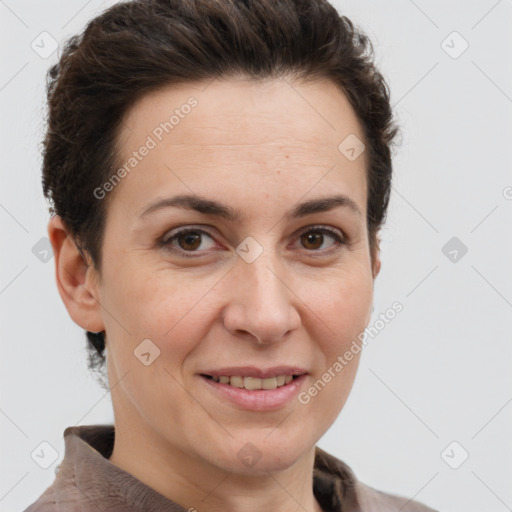 Joyful white adult female with short  brown hair and brown eyes