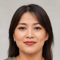 Joyful white young-adult female with medium  brown hair and brown eyes