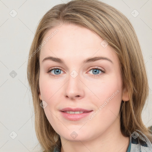 Joyful white young-adult female with medium  brown hair and blue eyes