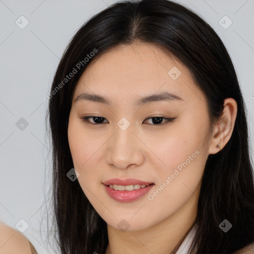 Joyful asian young-adult female with long  brown hair and brown eyes