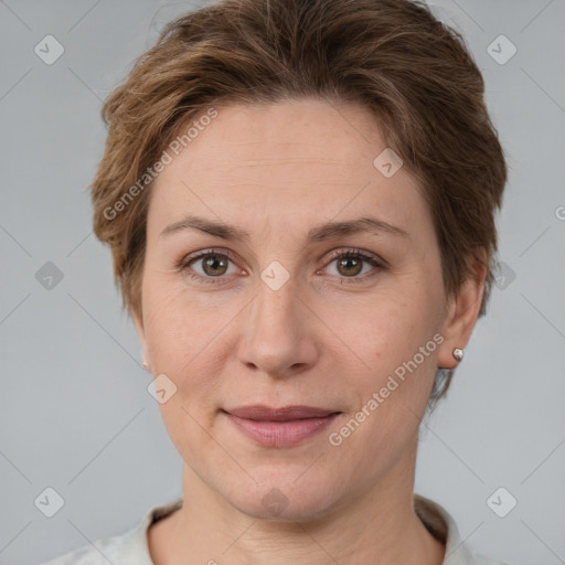 Joyful white adult female with short  brown hair and grey eyes