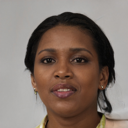 Joyful black young-adult female with medium  black hair and brown eyes