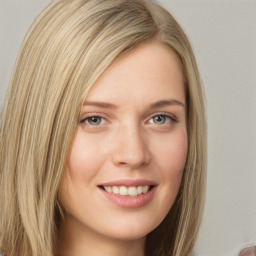 Joyful white young-adult female with long  brown hair and blue eyes