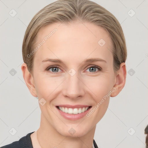 Joyful white young-adult female with short  brown hair and grey eyes