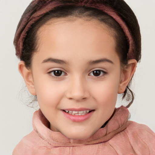 Joyful white child female with short  brown hair and brown eyes