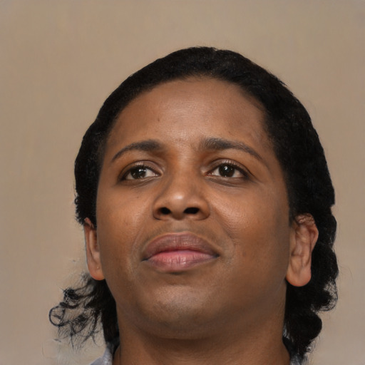 Joyful black young-adult female with medium  black hair and brown eyes