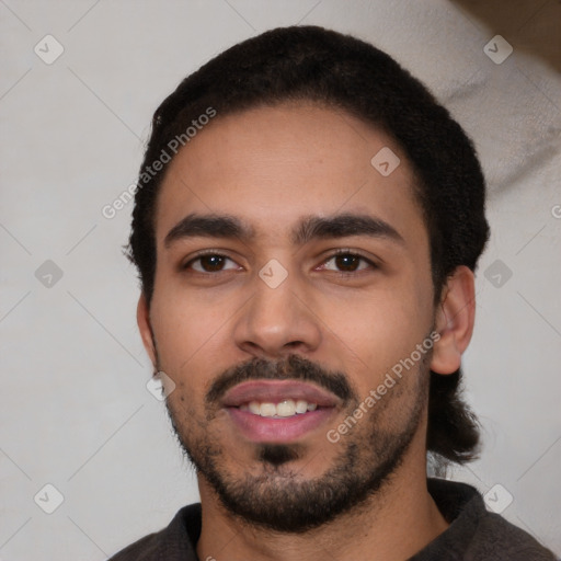 Joyful latino young-adult male with short  black hair and brown eyes