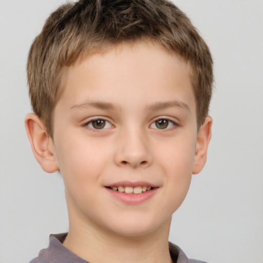 Joyful white child male with short  brown hair and brown eyes