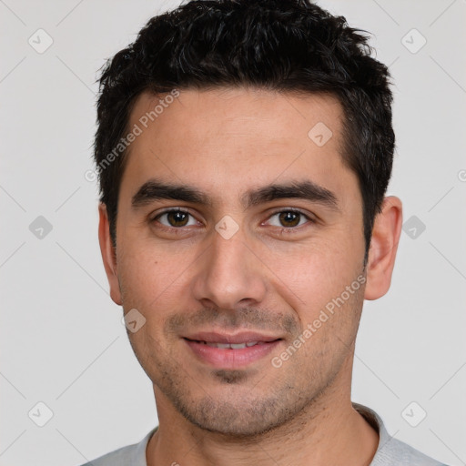 Joyful white young-adult male with short  black hair and brown eyes