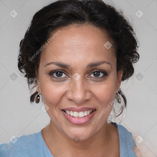 Joyful latino adult female with medium  brown hair and brown eyes