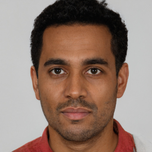 Neutral black young-adult male with short  black hair and brown eyes