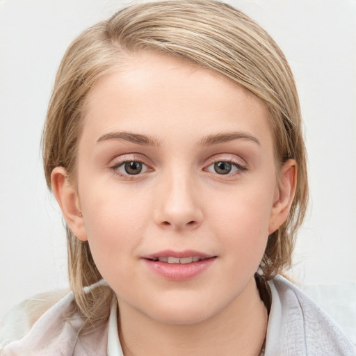 Joyful white child female with medium  brown hair and blue eyes