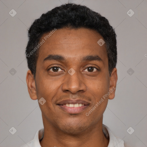 Joyful black young-adult male with short  black hair and brown eyes