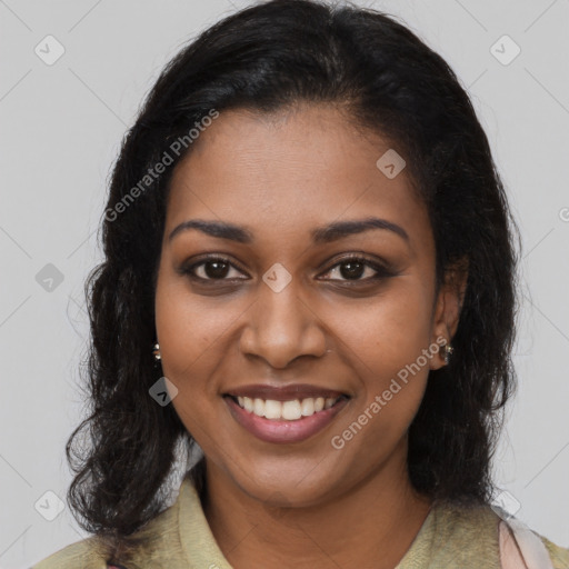 Joyful black young-adult female with long  brown hair and brown eyes