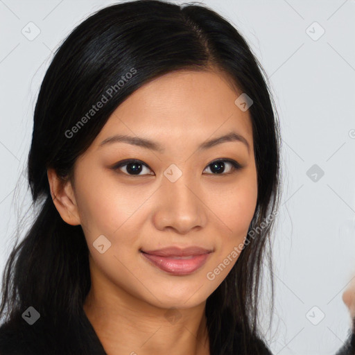 Joyful asian young-adult female with long  brown hair and brown eyes