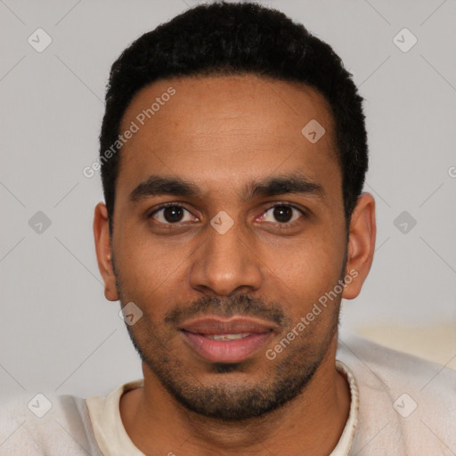 Joyful latino young-adult male with short  black hair and brown eyes
