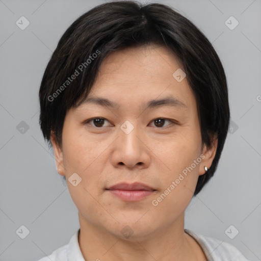 Joyful asian young-adult female with short  brown hair and brown eyes