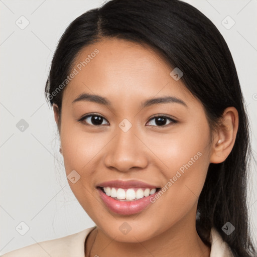 Joyful latino young-adult female with long  brown hair and brown eyes