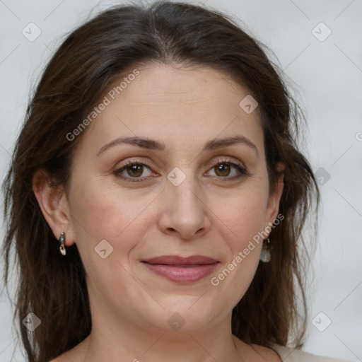 Joyful white adult female with medium  brown hair and grey eyes