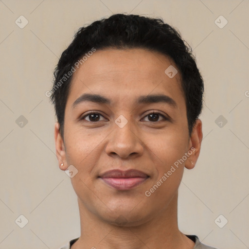 Joyful latino young-adult male with short  black hair and brown eyes