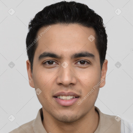 Joyful latino young-adult male with short  black hair and brown eyes