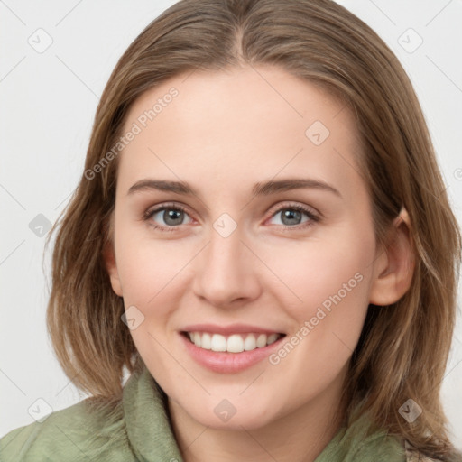 Joyful white young-adult female with medium  brown hair and green eyes