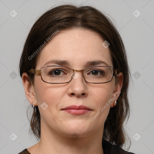 Joyful white adult female with medium  brown hair and grey eyes