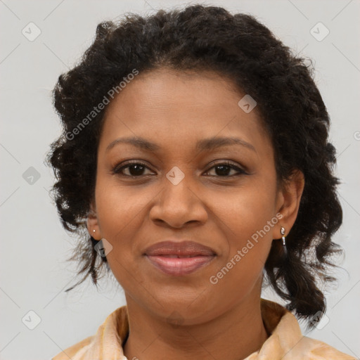 Joyful black adult female with medium  brown hair and brown eyes