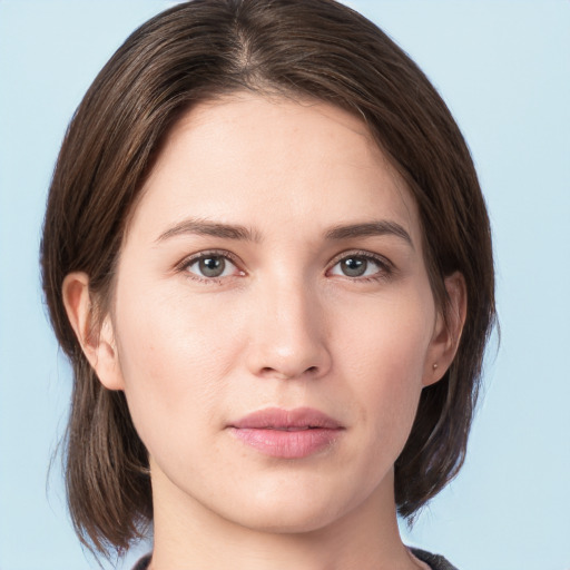 Neutral white young-adult female with medium  brown hair and grey eyes