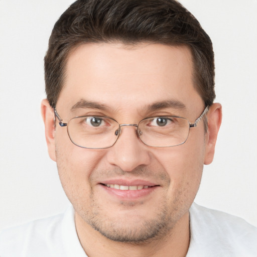 Joyful white young-adult male with short  brown hair and brown eyes