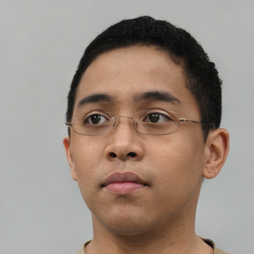 Neutral latino young-adult male with short  brown hair and brown eyes