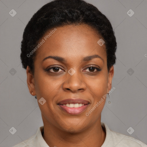 Joyful black young-adult female with short  brown hair and brown eyes