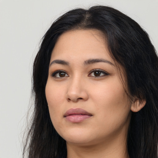 Neutral latino young-adult female with long  black hair and brown eyes
