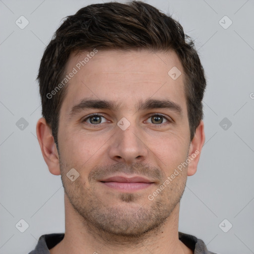 Joyful white young-adult male with short  brown hair and brown eyes