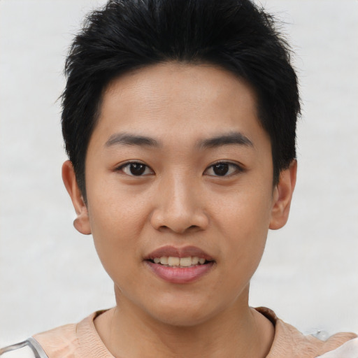 Joyful asian young-adult female with short  black hair and brown eyes