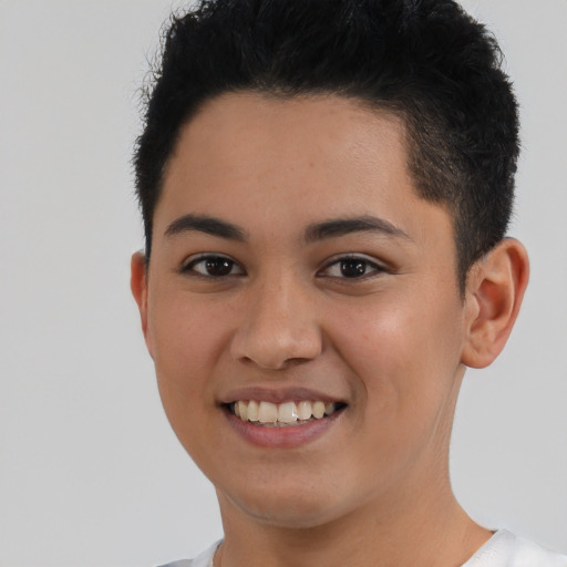 Joyful latino young-adult female with short  black hair and brown eyes