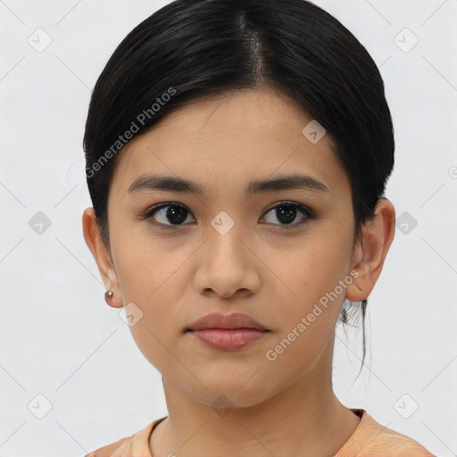 Joyful asian young-adult female with medium  black hair and brown eyes