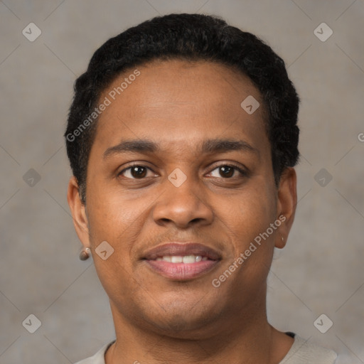 Joyful black young-adult male with short  black hair and brown eyes