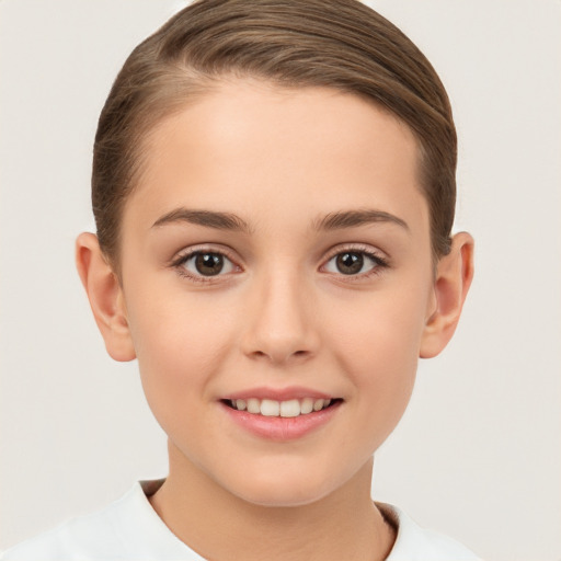 Joyful white child female with short  brown hair and brown eyes